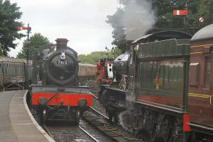 7802 awaits the road at Bridgnorth with the 16.05 departure to Kidd whilst 7812 drifts in with the 14.45 ex Kidderminster on 22 Aug