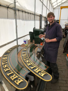 Scott standing with his handiwork on the name plates [Photo: Paul Fathers]: