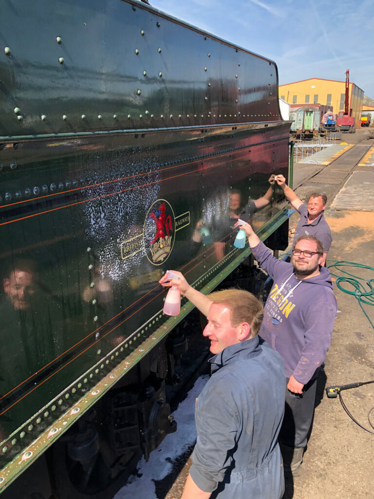 On 30th April, a team of volunteers travelled up from the West Somerset Railway to work their magic on restoring the paint finish on the tender tank. [Photo: Paul Fathers]