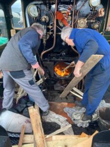 On 8th November, EMF volunteers Bill Hall and Terry Jenkins are seen lighting the first warming fire in 7812 [Photo: Dave Giddins