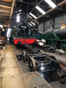 Following the two previous test steamings, 7812 is seen with the bogie removed using the Tyseley Works wheel drop to lower it down and then draw the locomotive back clear of it to allow easy access. The actual work required could then be done quite quickly and the bogie was replaced under 7812 later the same day, showing the value of having such facilities to hand [Photo: Paul Fathers]: