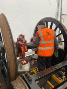 Also on 22nd July, trustee Jane Preece is seen putting the final coat on the driving wheelset axle. Photo: Ben Morris